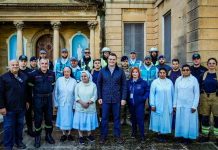 Law enforcement officers collect and distribute food to those in need