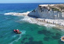 Three people and dog rescued from rough seas